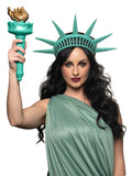A person wearing a green Statue of Liberty latex tiara with a thick elastic band holding it in place.