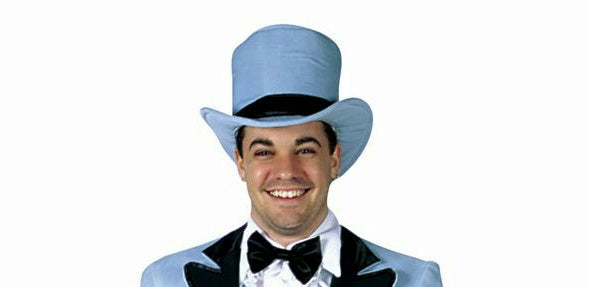 A person wearing a blue tuxedo and a top hat with a black band.